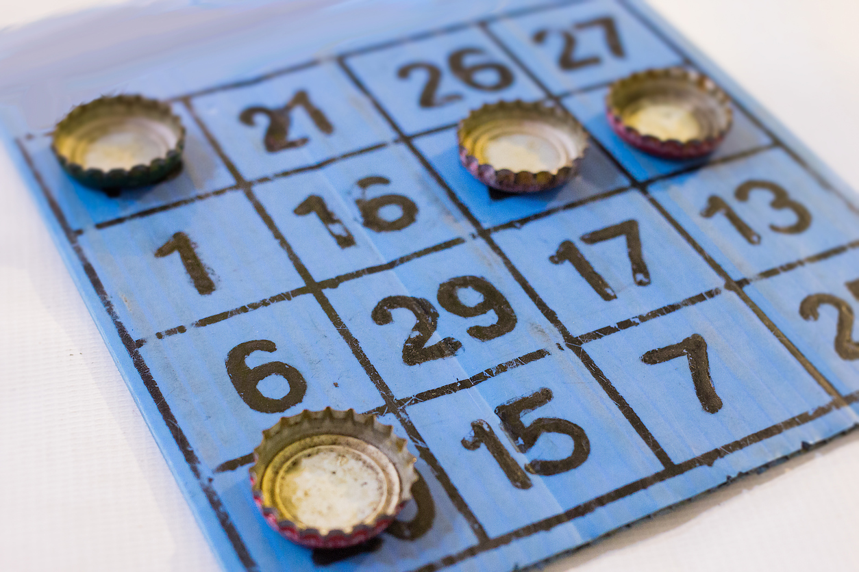 Bingo card played with bottle caps.